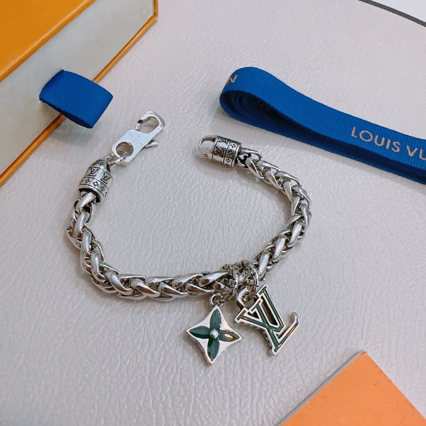 Louis Vuitton Silver Bracelet with LV Logo and Green Flower Charm
